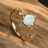 Bague artisanale avec pierre précieuse opale d'or | Or
