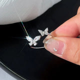 Bague réglable avec un papillon éclatant | Or blanc