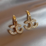 Boucles d'oreilles signature brillantes | Or