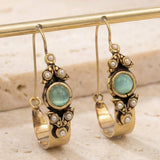 Boucles d'oreilles au style ethno-rétro avec pendentif | Or