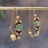 Boucles d'oreilles au style ethno-rétro avec pendentif | Or