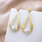 Boucles d'oreilles avec des cristaux et des perles rondes | Or