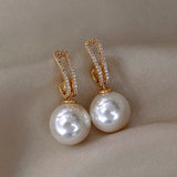 Boucles d'oreilles élégantes avec perles et brillants | Or
