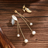 Boucles d'oreilles en forme de feuille avec des marguerites | Or