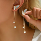 Boucles d'oreilles en forme de feuille avec des marguerites | Or