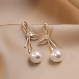 Boucles d'oreilles en perles avec bande brillante | Or
