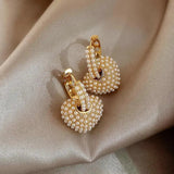 Boucles d'oreilles en perles d'amour | Or
