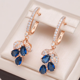 Boucles d'oreilles pendantes avec des cristaux bleus | Or