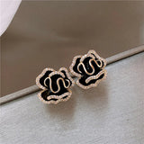 Boucles d'oreilles pendantes « fleur de lotus noire » | Or