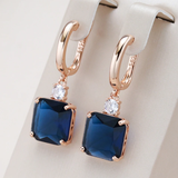 Boucles d'oreilles pendantes en cristal bleu foncé | Or