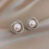 Boucles d'oreilles spirales brillantes avec des perles élégantes | Or