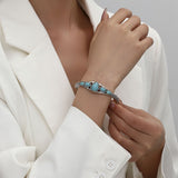 Bracelet ouvert en forme de goutte d'eau turquoise | Or blanc