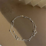 Bracelet ajustable avec cœur | Or blanc
