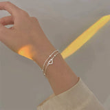 Bracelet ajustable avec cœur | Or blanc