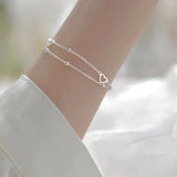 Bracelet ajustable avec cœur | Or blanc