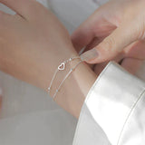 Bracelet ajustable avec cœur | Or blanc