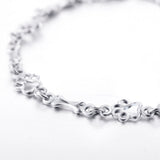 Bracelet avec pattes de chien suspendues et Os Brut, Édition limitée | Or blanc