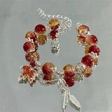 Bracelet avec feuille d'automne et papillon | Or blanc