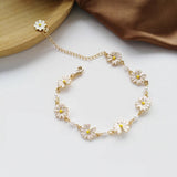 Bracelet rétro avec des marguerites et fleurs blanches | Or