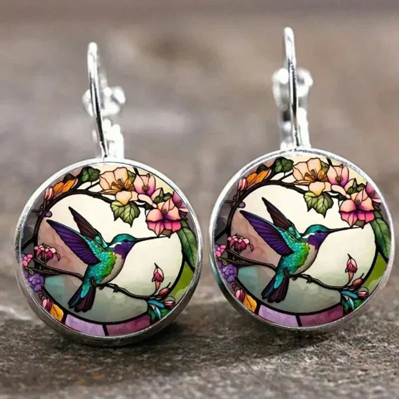 Collier avec pendentif en métal en forme d'hirondelle avec dôme en verre | Or