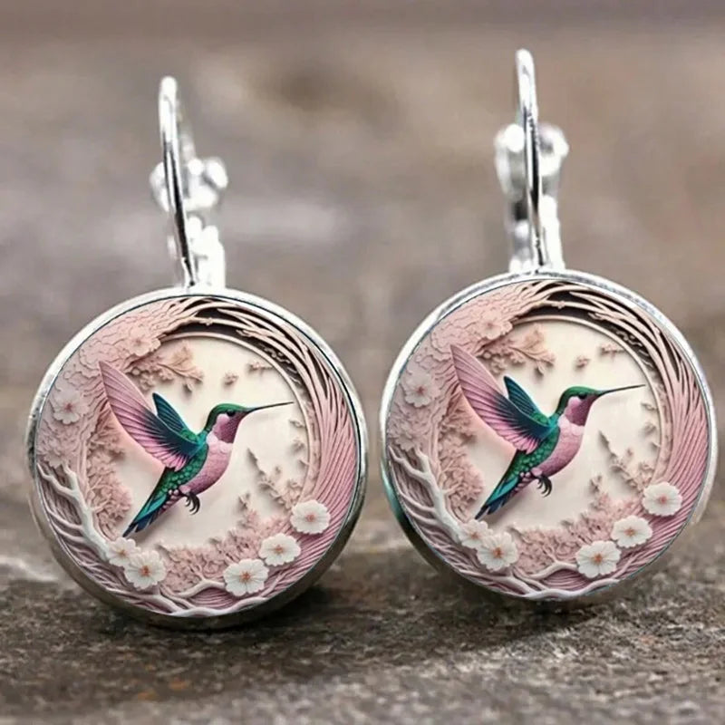 Collier avec pendentif en métal en forme d'hirondelle avec dôme en verre | Or