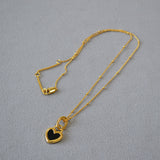Collier avec pendentif en noir et blanc cœur | Or