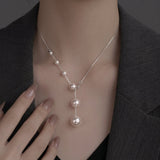 Collier élégant avec perles suspendues | Or