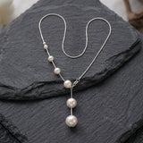 Collier élégant avec perles suspendues | Or