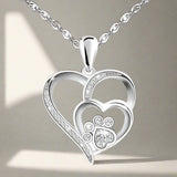Collier avec patte et cœur à brillants | Or blanc