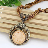 Collier rétro avec pendentif ethnologique en cristal vert | Or