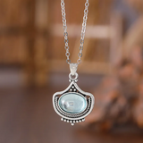 Collier rétro et boucles d'oreilles avec des pierres précieuses ovales bleues | Or