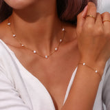Ensemble complet de collier et bracelet avec des marguerites en acier inoxydable | Or