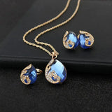 Ensemble de collier et boucles d'oreilles en cristal bleu avec dorure | Or