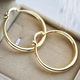 Grandes boucles d'oreilles en forme d'anneau | Or